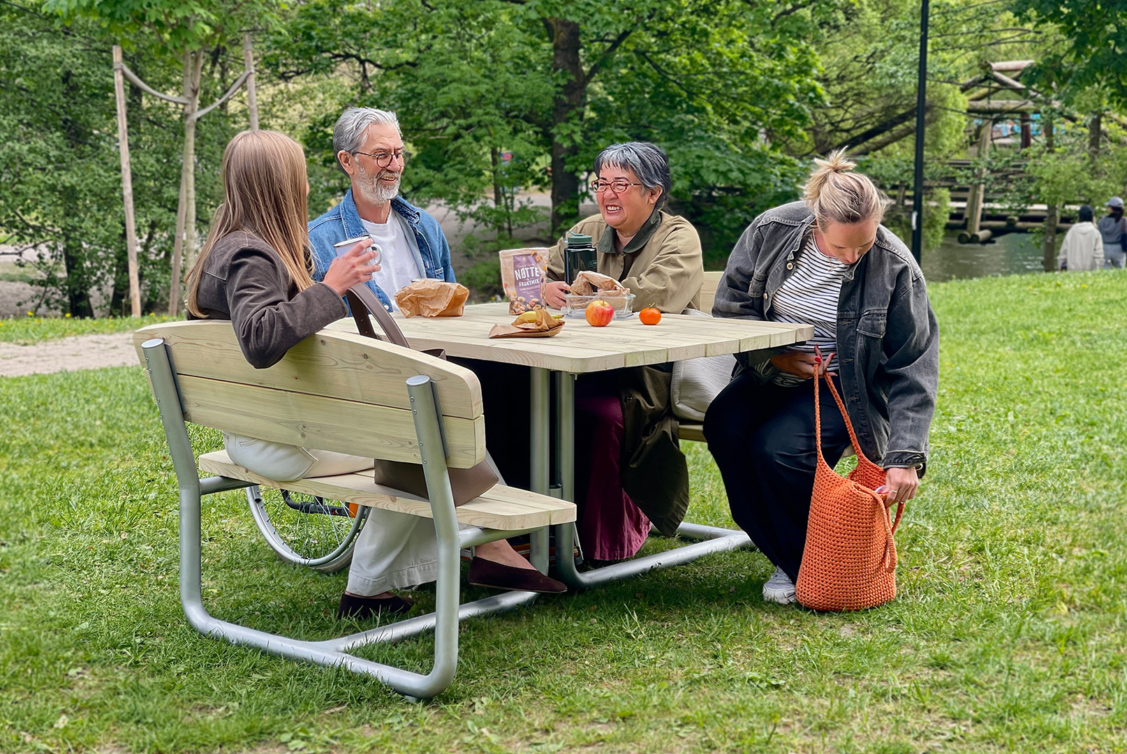 Some people sitting around a picnic table